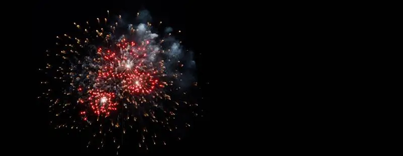 Red and Yellow Fireworks Banner on a Black Background