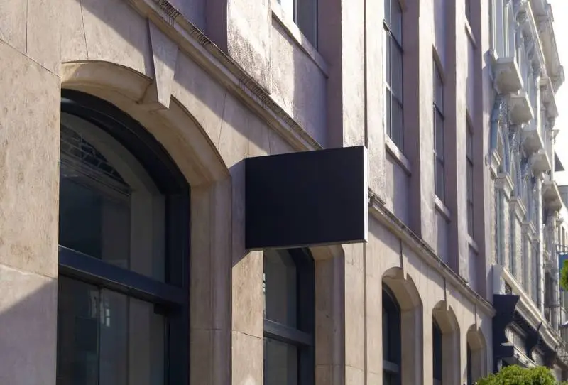 Black Street Sign on Classic Stone Building