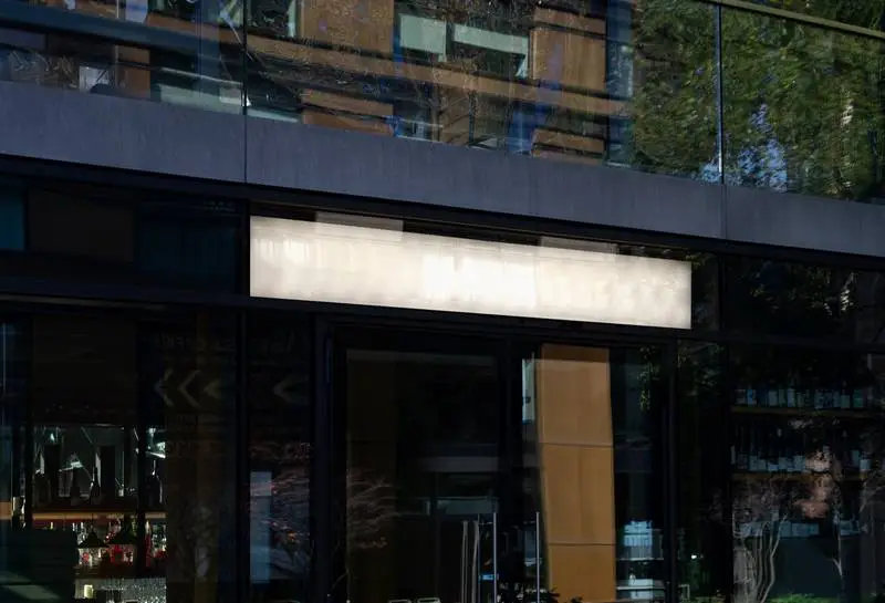 Horizontal Illuminated Poster on Glass Façade
