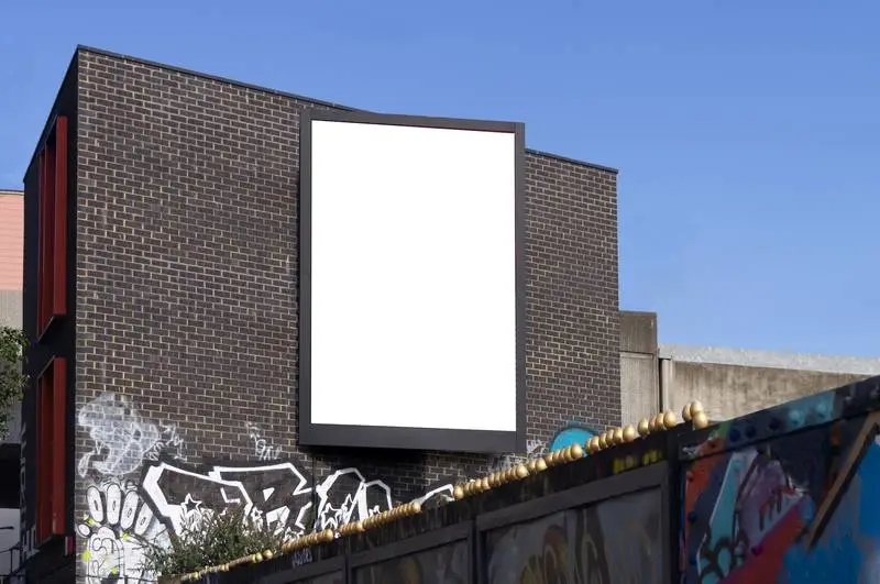 Vertical Poster on Façade of Brick Building