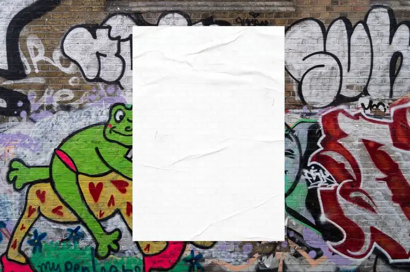 White Poster on Wall with Coloured Graffiti