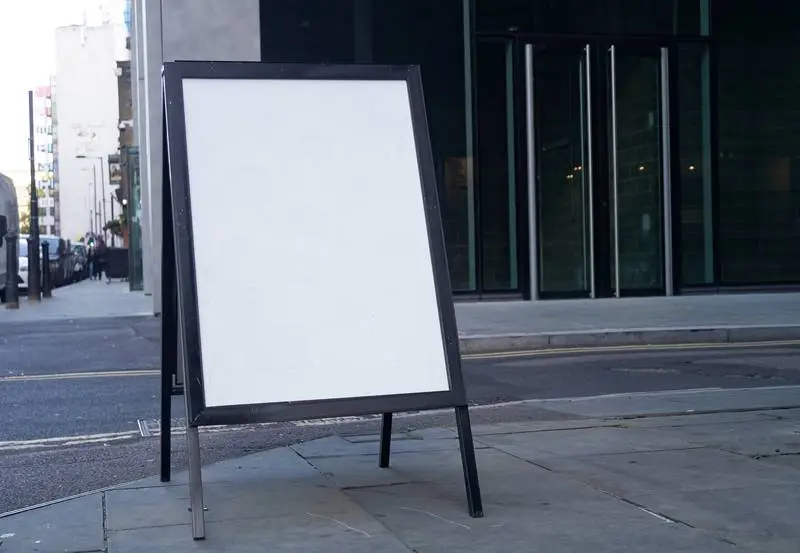 White Street Sign on Pavement