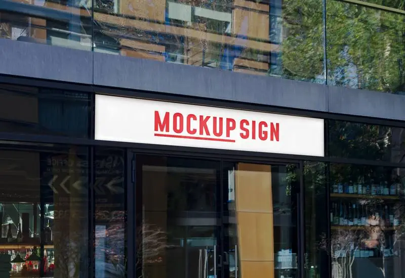 Mockup of Street Sign with Light on Glass Building