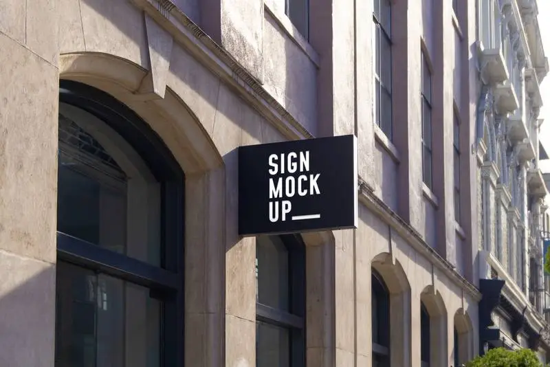 Street Sign Mockup with Classic Building and Text Effect