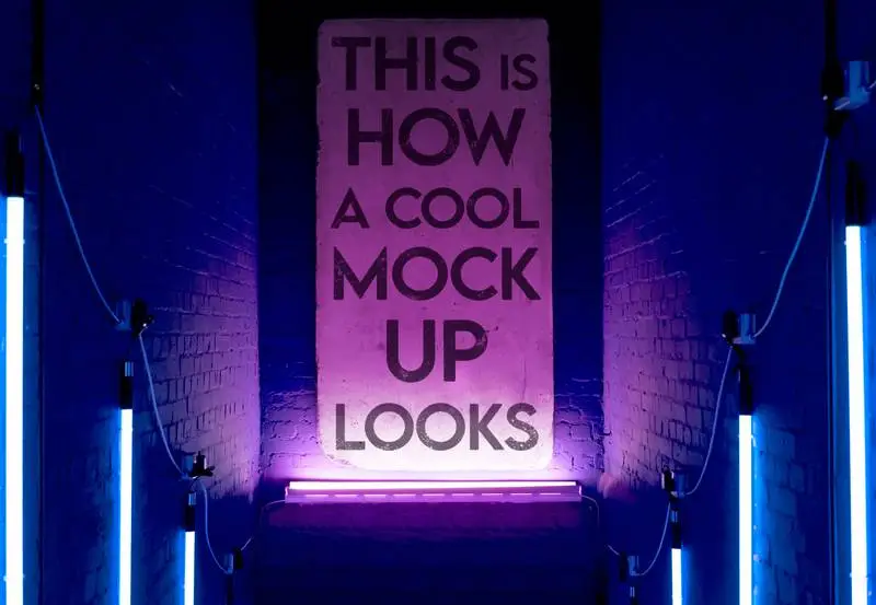 Mockup of Grunge Sign Illuminated by Neon Lights Indoors