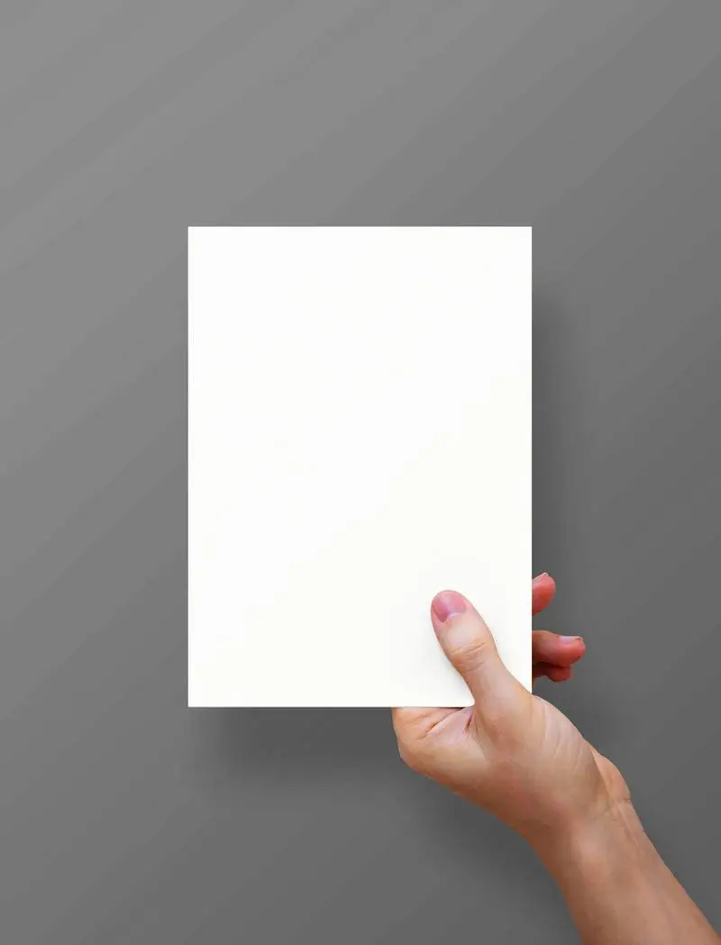 Hand Holding A5 Paper Sheet Photo
