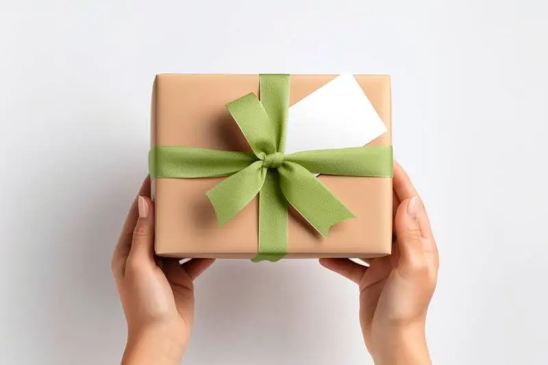 Gift Card with Hands Holding Gift Package Photo
