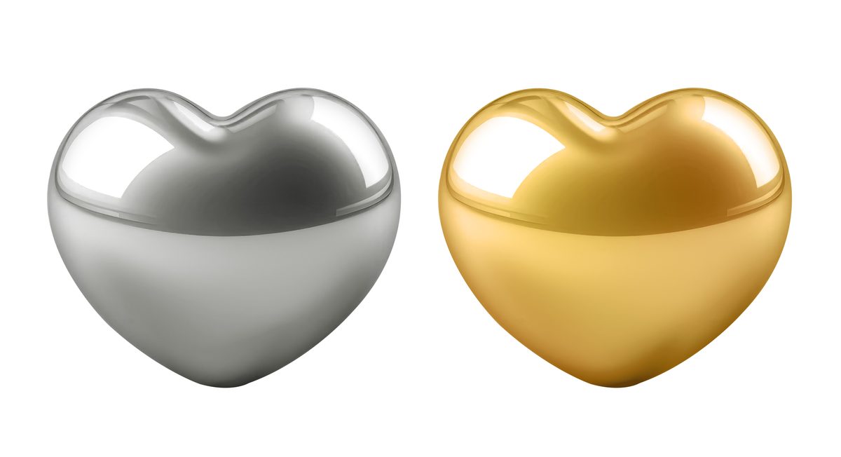 3D gold and silver hearts isolated on white background
