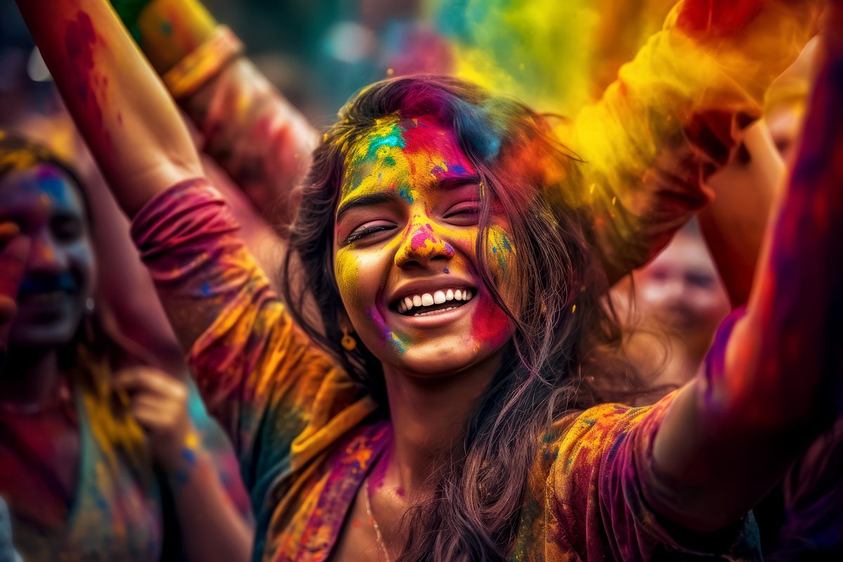 Beautiful Indian Girl Celebrating Holi Covered with Bright Colors