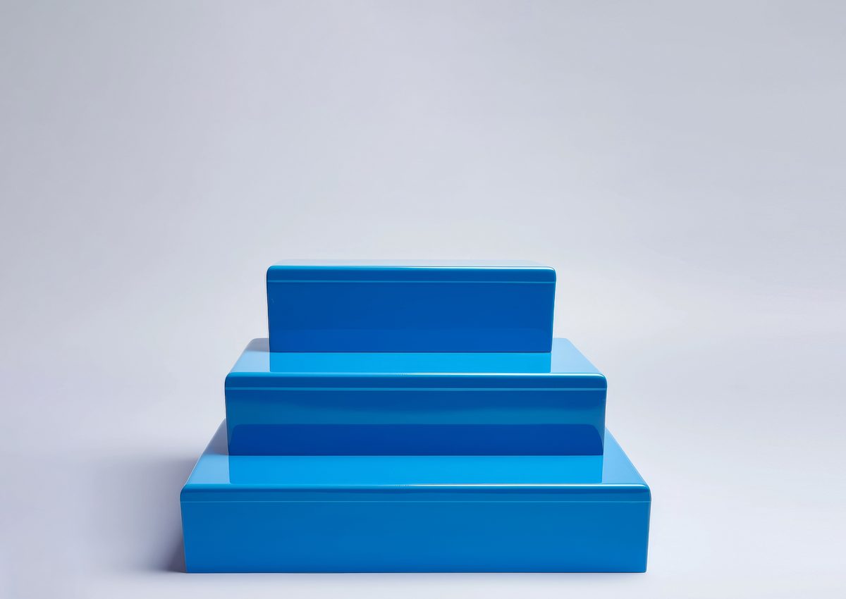 Blue stepped empty podium for product presentation on a grey background