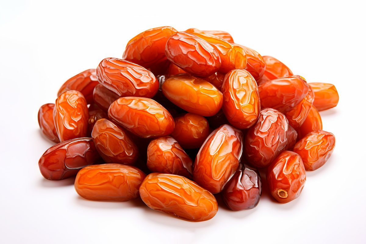 Pile of dried dates isolated on a white background