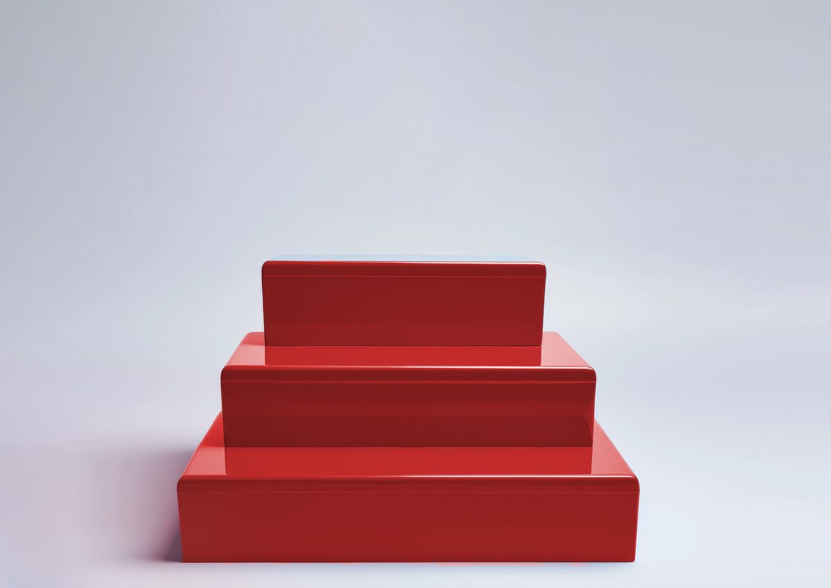 Red stepped empty podium for product presentation on a grey background