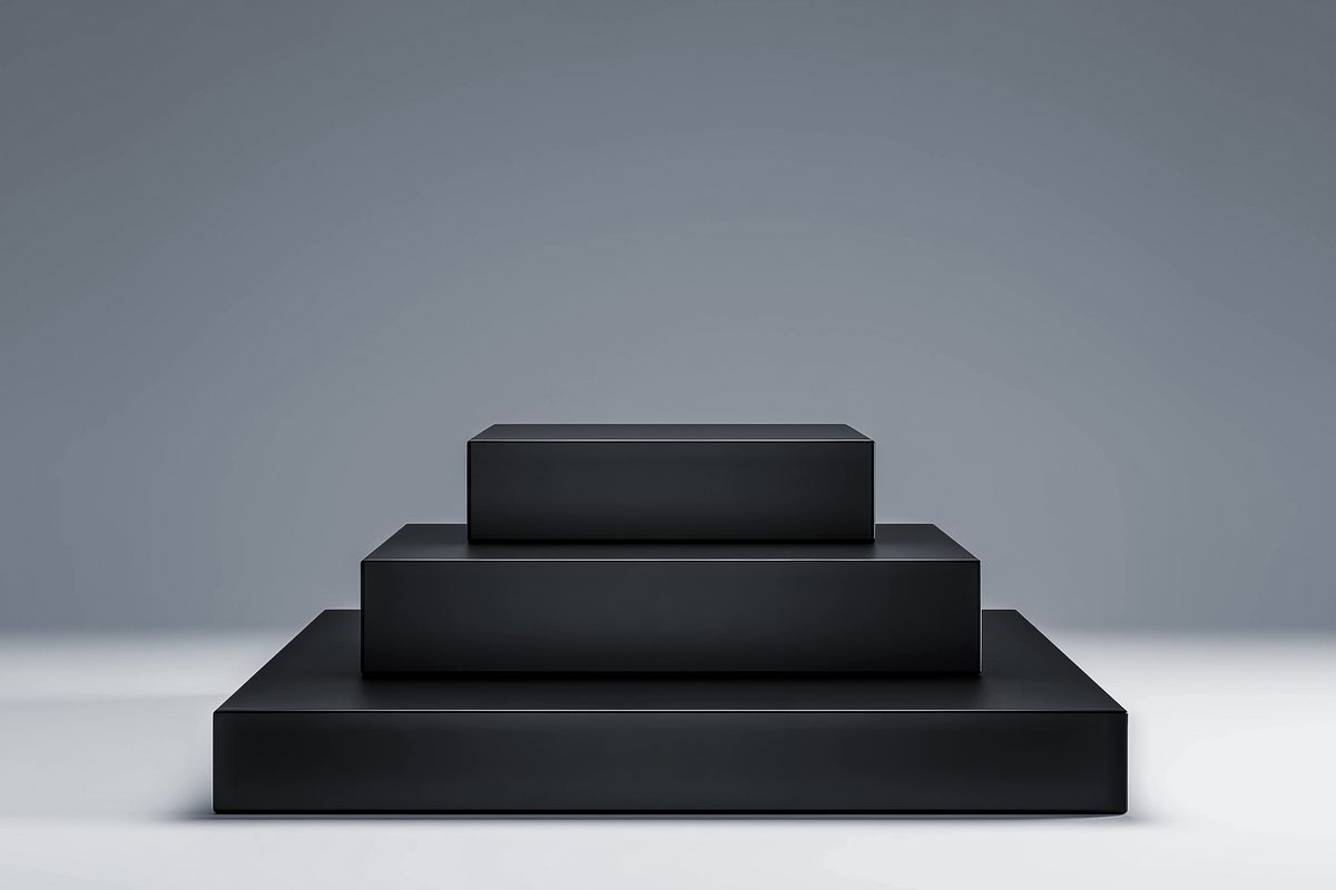 Simple black stepped podium for product presentation in a light background