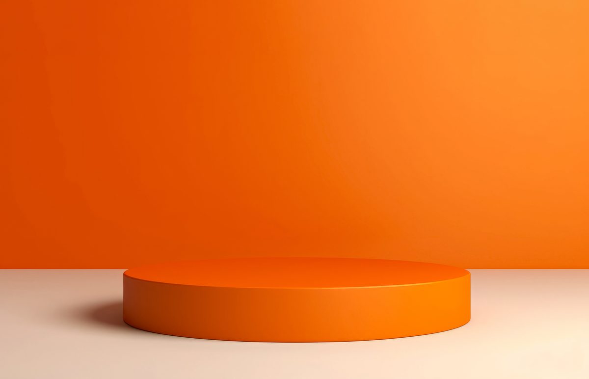 Simple orange round empty podium for product presentation on a minimalist backdrop