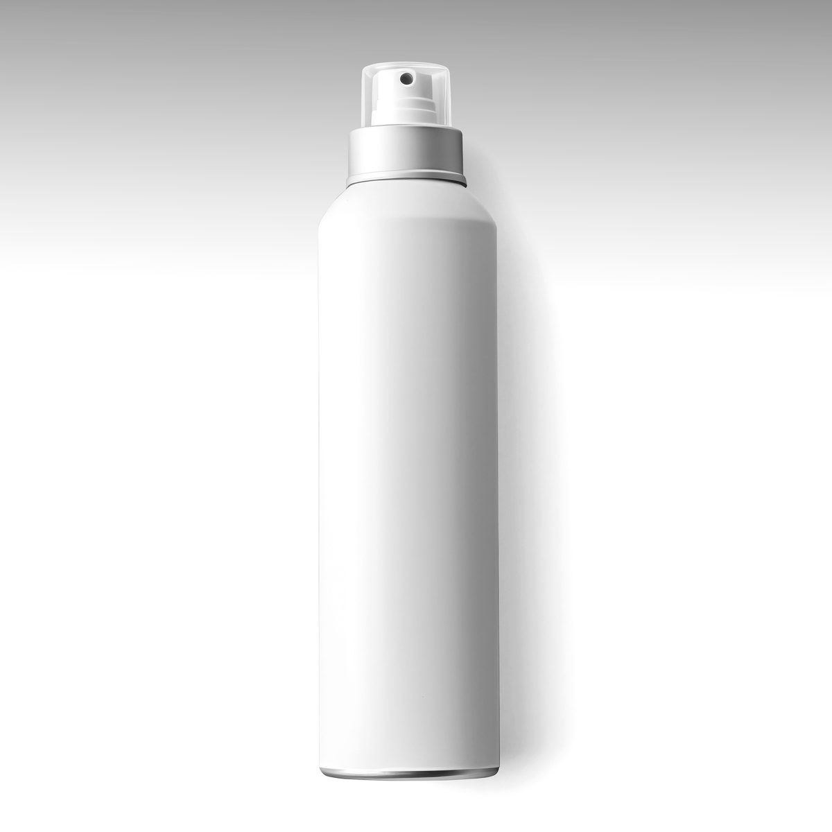 White spray bottle isolated on light background