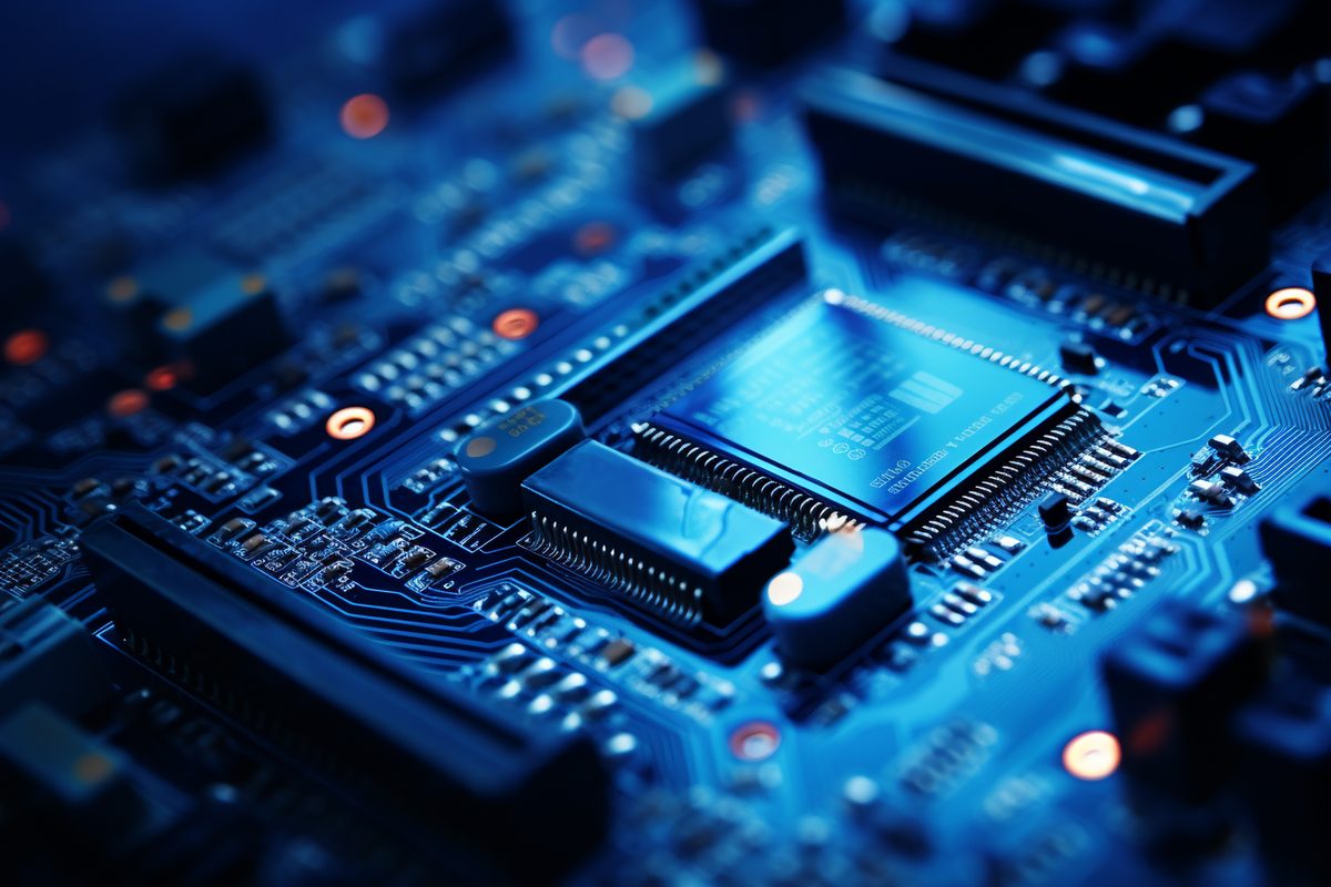 Detailed macro photography of an electronic motherboard in blue colors