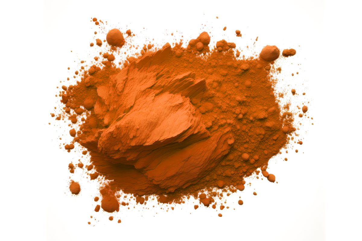 Holi Orange Powder over White Background