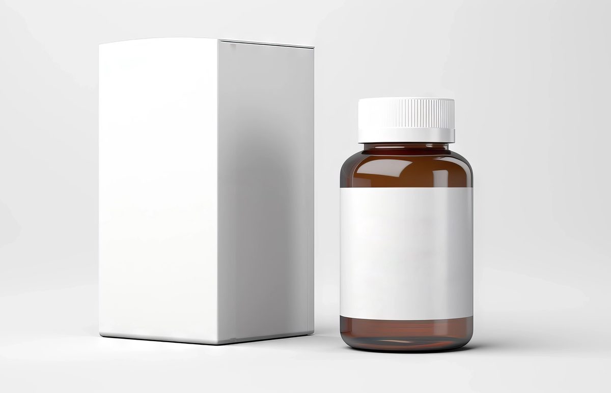 Plastic canister with blank cardboard box isolated on a white background