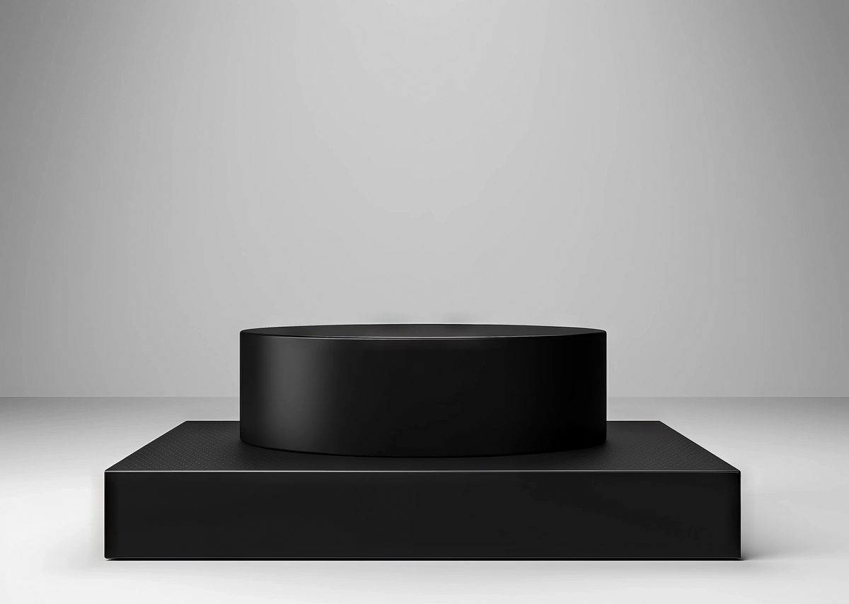 Minimalist black podium for product presentation on a white background
