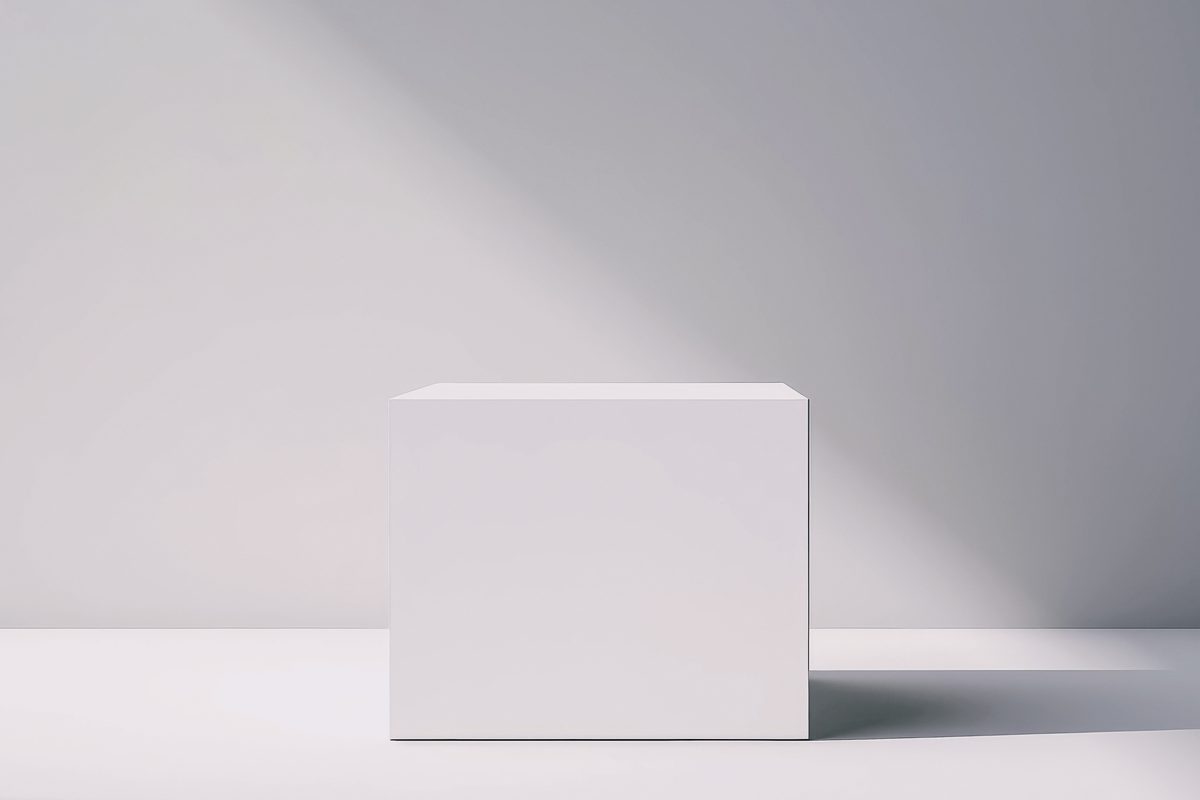 Minimalist white cube podium for product presentation on a light background