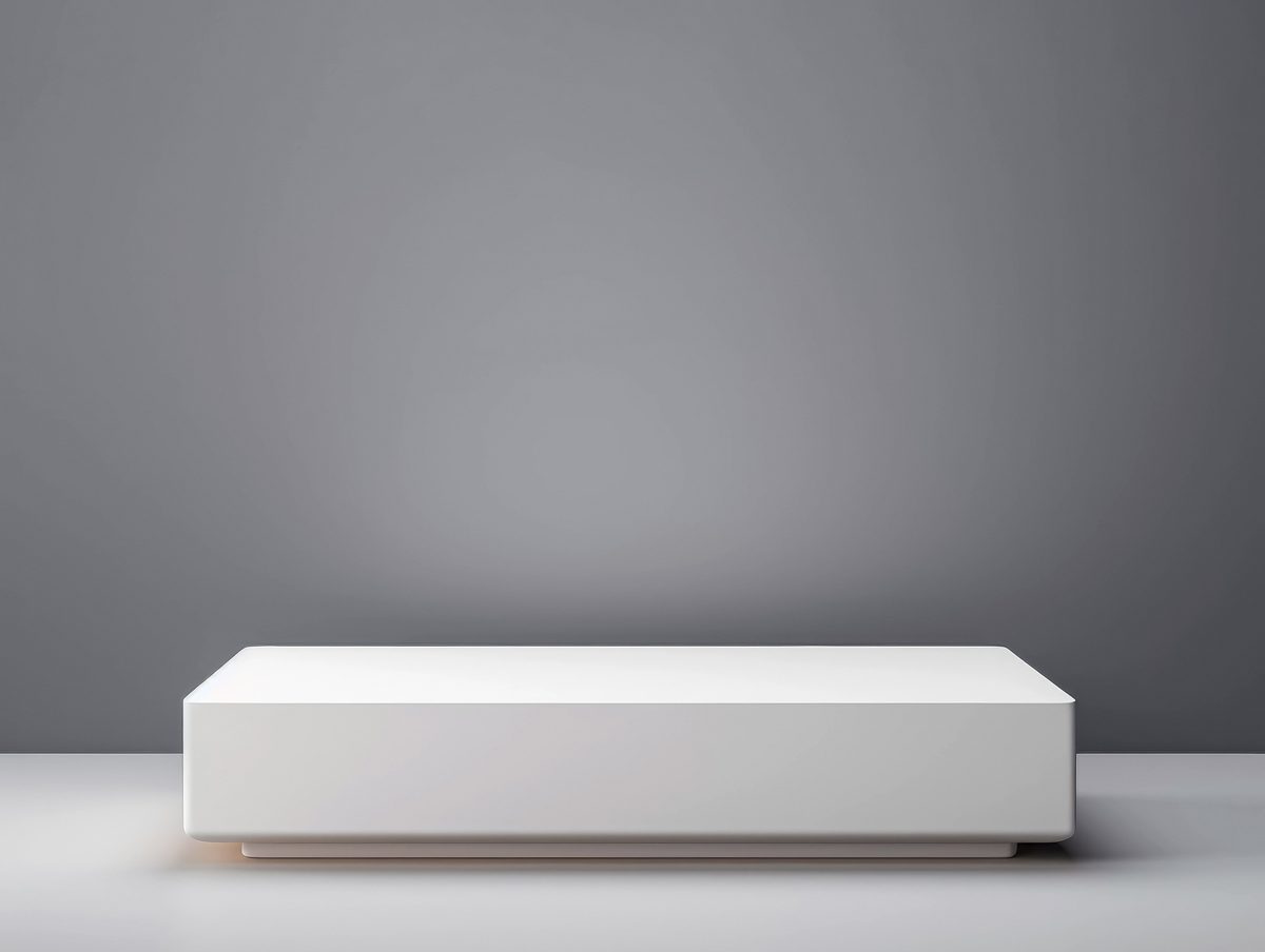 Minimalist white podium for product presentation on a white background