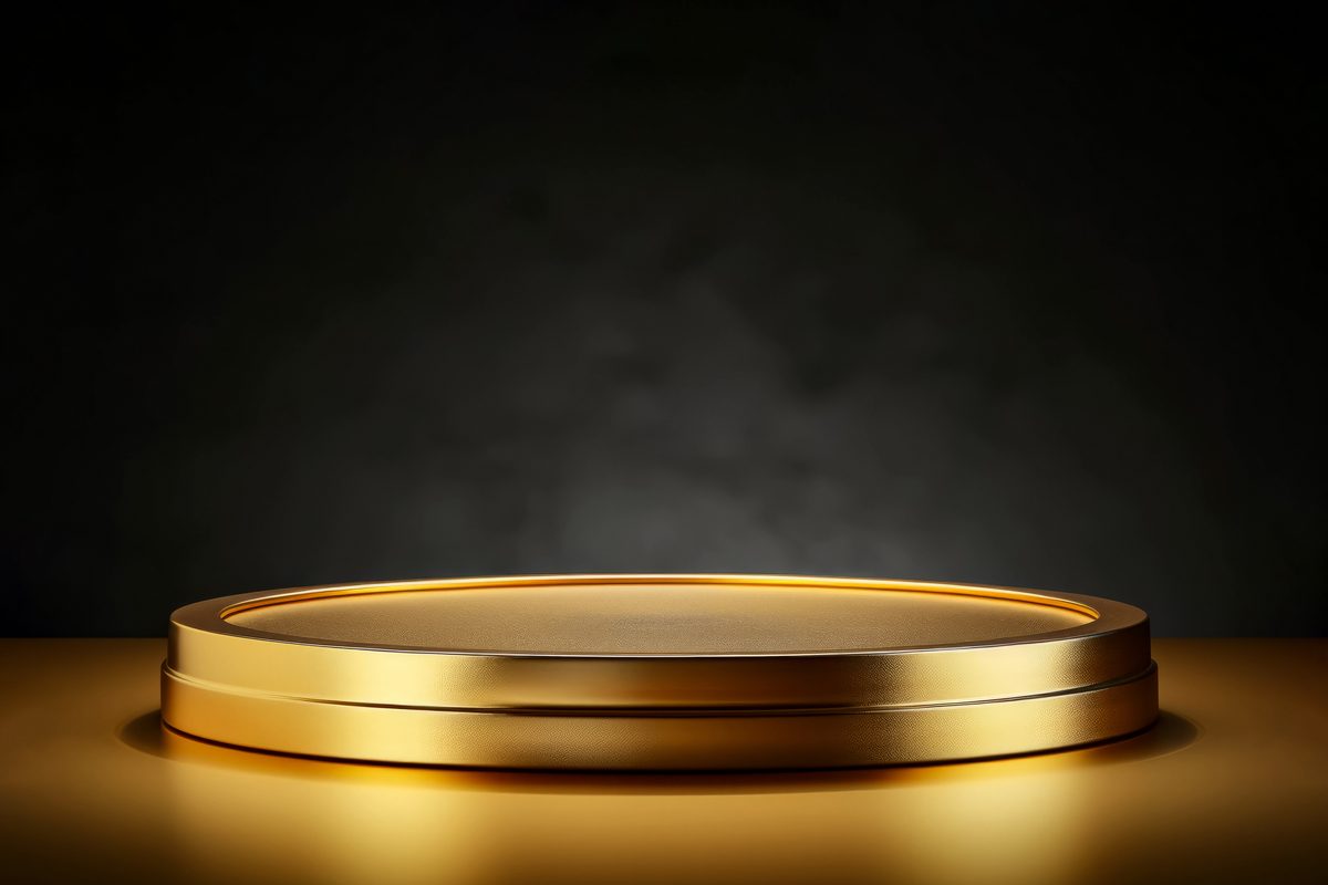 Empty golden podium for product presentation on a black background